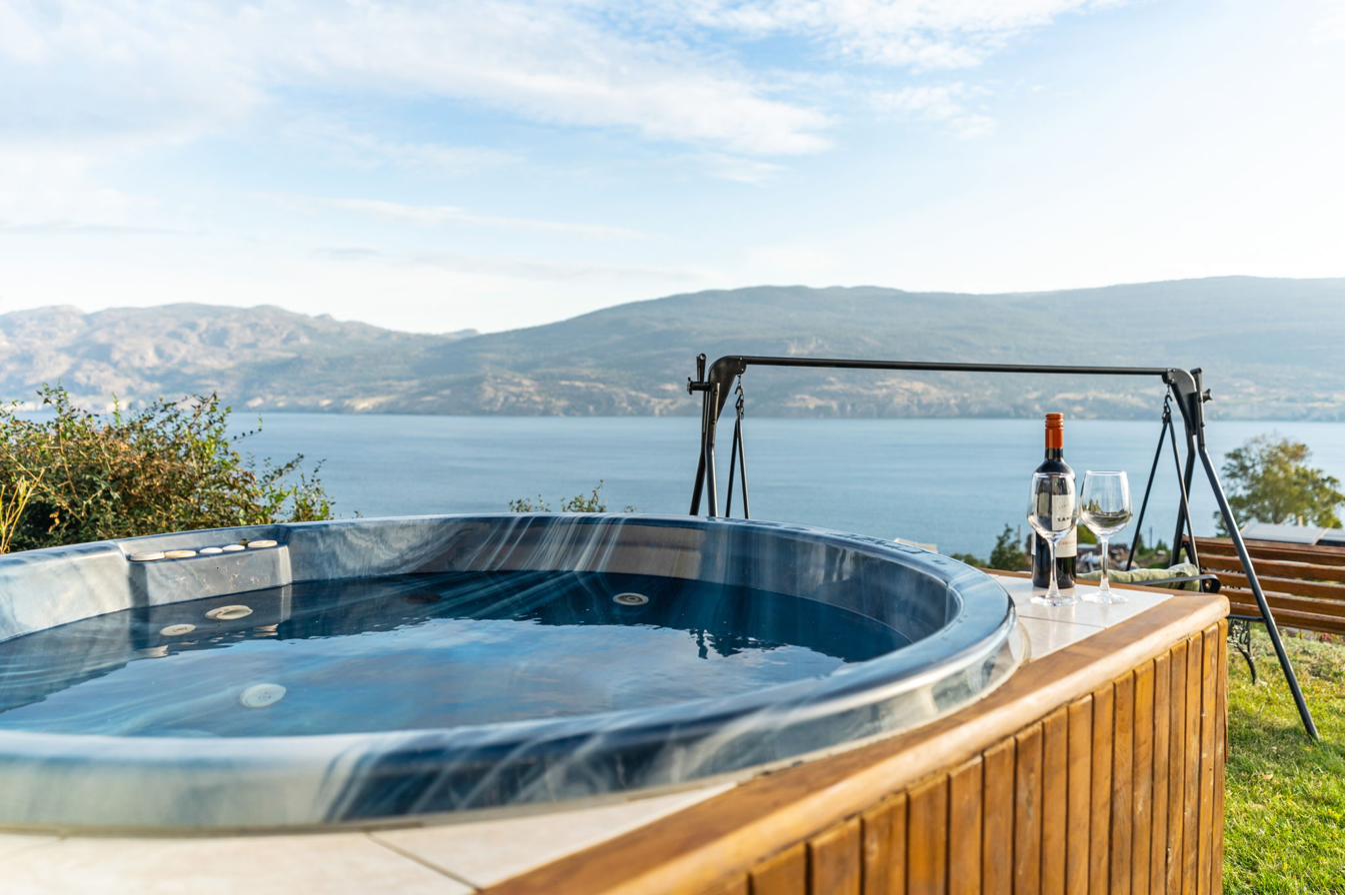 Private cedar hot tub with Okanagan Lake view and wine