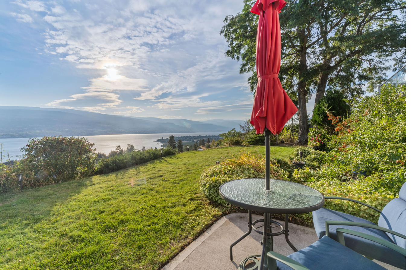 Patio seating area with 180° Okanagan Lake and mountain view