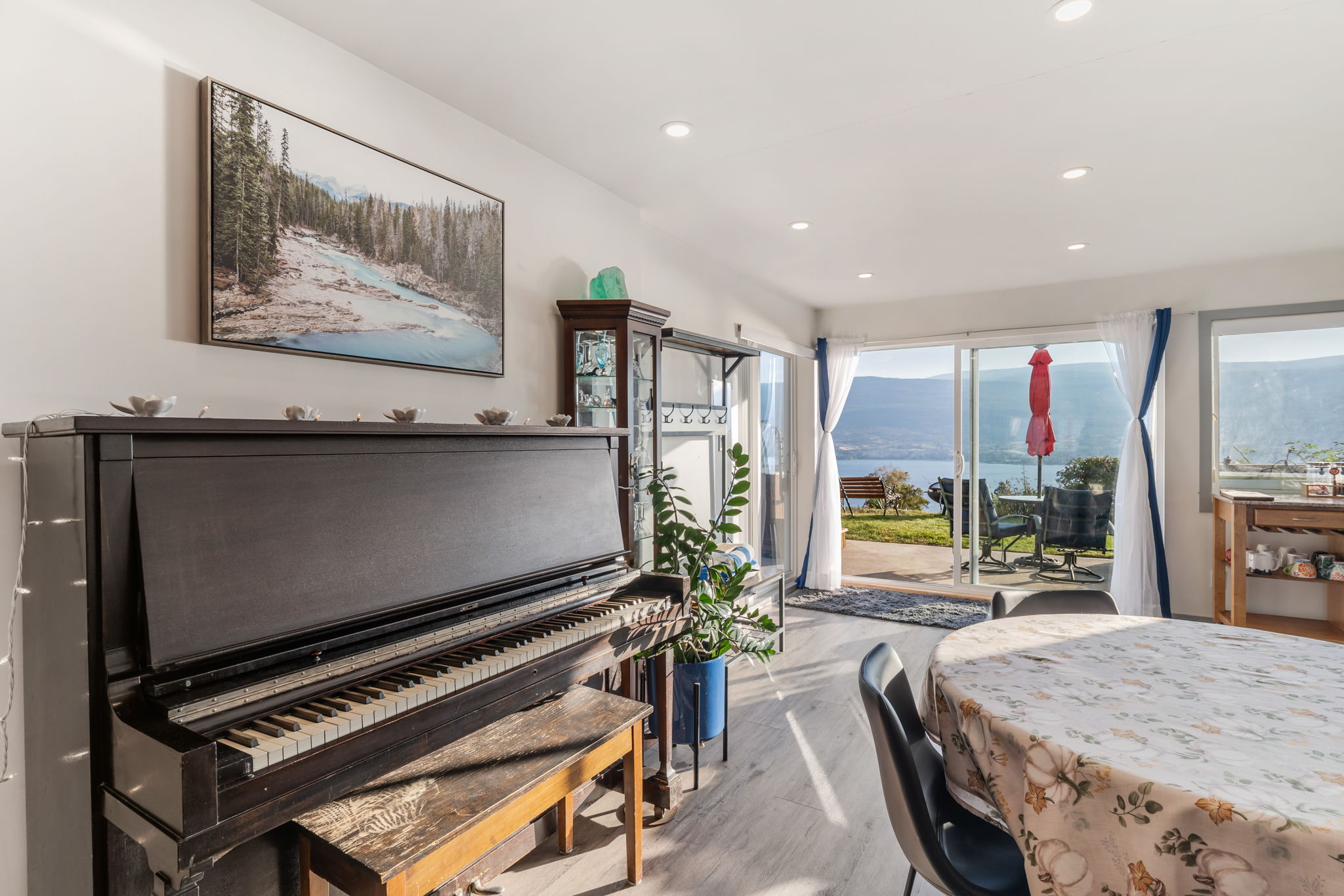 The vintage upright piano in the living area — play a sunset tune