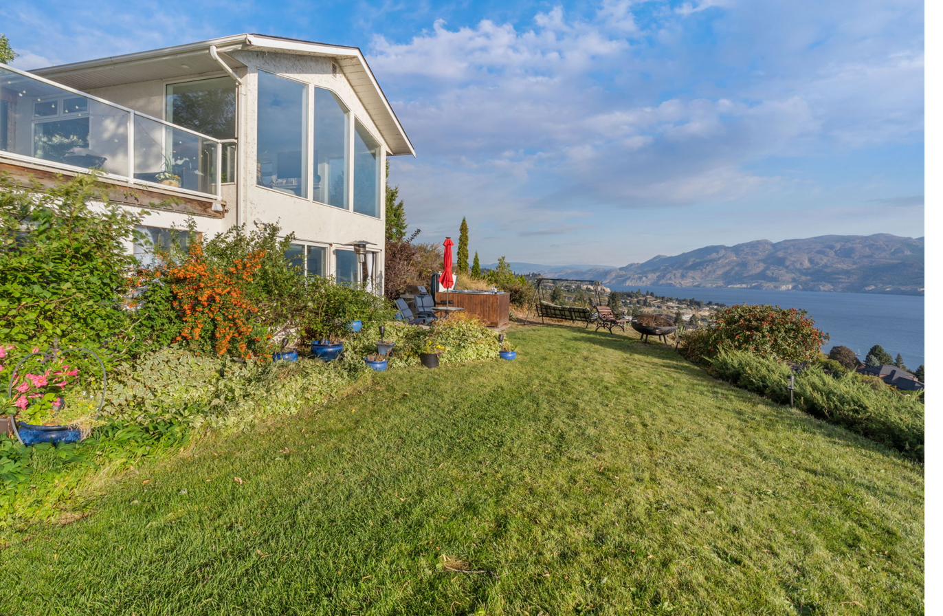 Private yard with green lawn and garden surroundings